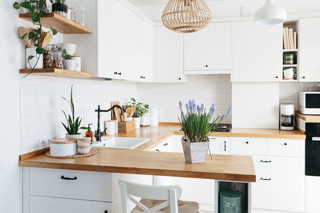 Blue muscari flower on white modern kitchen scandinavian style. Spring decoration eco friendly kitchen