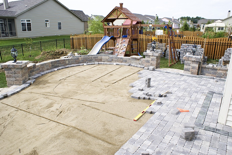 Paving patio on to leveled sand. Backyard Project.