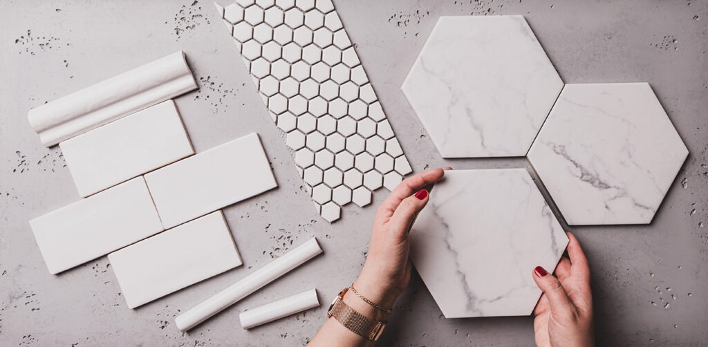 Interior design and home decoration - different shapes of white ceramic and gres tiles. Designer choosing bathroom or kitchen renovation materials. Captured from above (top view, flat lay).