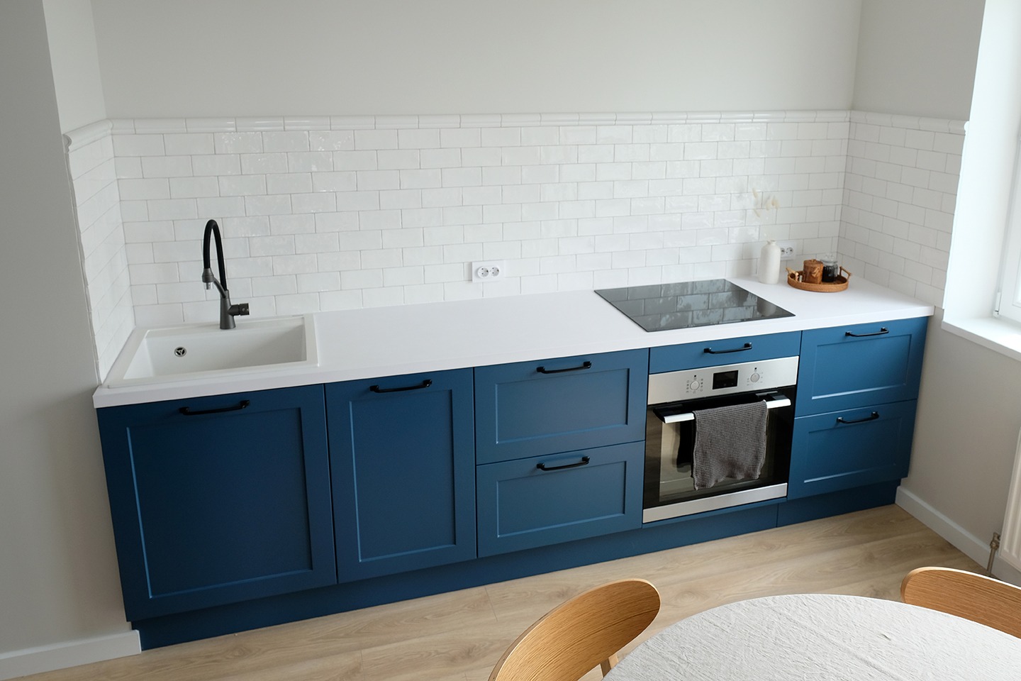 Scandinvain style blue kitchen furniture. Nordic small kitchen interior design